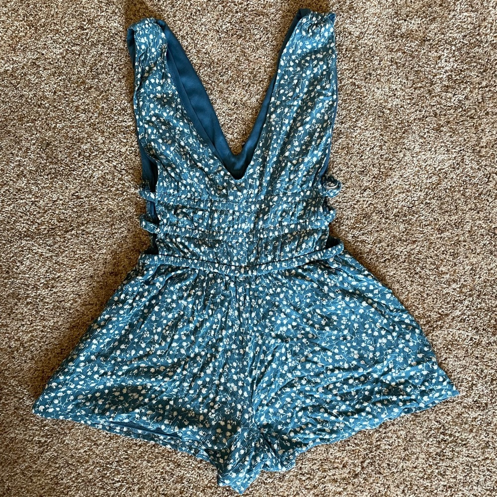 Blue floral romper with cut out on the side